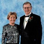 smiling woman and man dressed up in formal wear